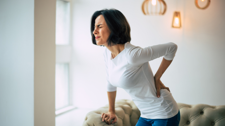 Women with back pain looking for natural pain relief from her local chiropractic clinic